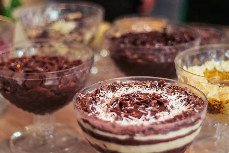 A selection of delicious Brazilian desserts, artfully presented in elegant glass bowls, perfect for indulging in sweet flavors.