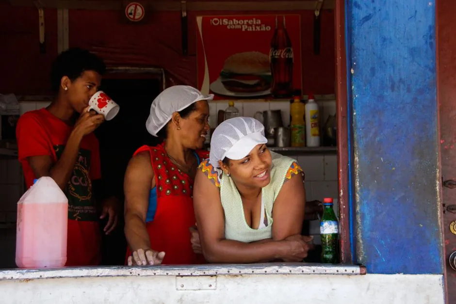 Three people enjoying a casual day at a café in Mindelo, Cape Verde.