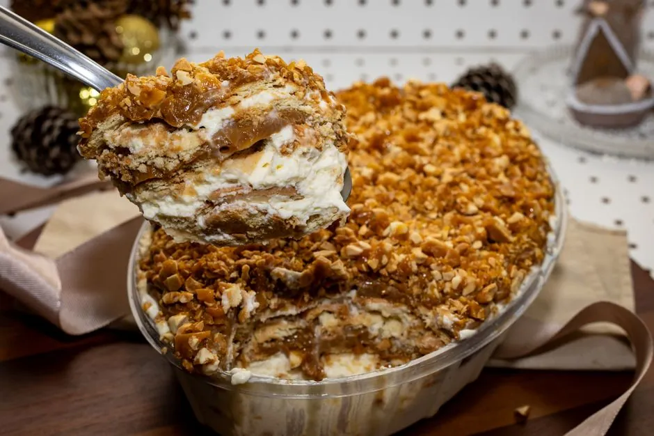 Indulgent dessert with layers of cream, caramel, and crunchy nuts, perfect for festive occasions.