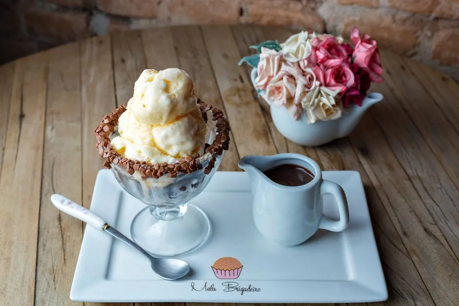 A delectable ice cream sundae with chocolate sauce, perfect for dessert lovers.